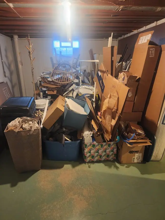 Roll-off dumpster container at job site for 2 Yard Dumpster Rental in Creedmoor